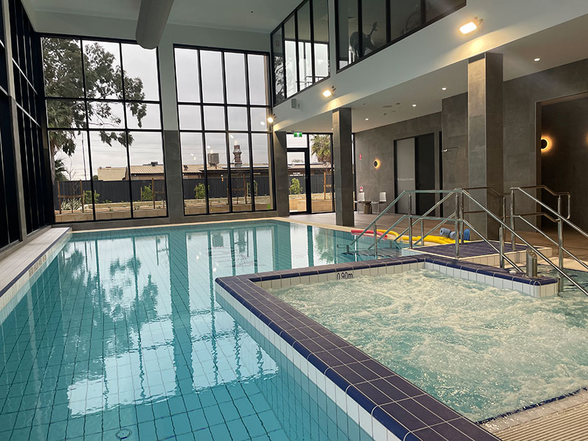 The pool and spa area at Aura Retirement Village is bright and inviting, and a move away from a clinical hydrotherapy pool.