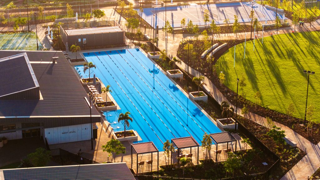 An aerial image at sunset of the swimming pool and surrounding landscaping at Mungala Resort