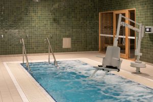 Corner view of SASI's recovery pool with accessibility chair